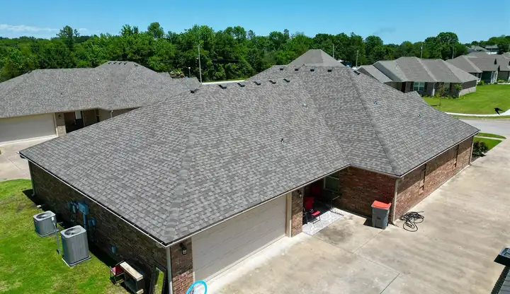 Drone view of a duplex with a finished shingle roof